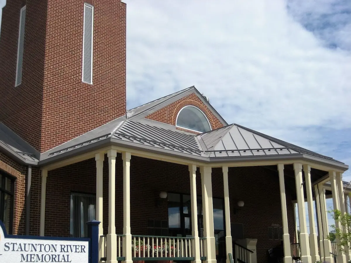 Skilled roofing craftsmen working on a residential roof in Indianview